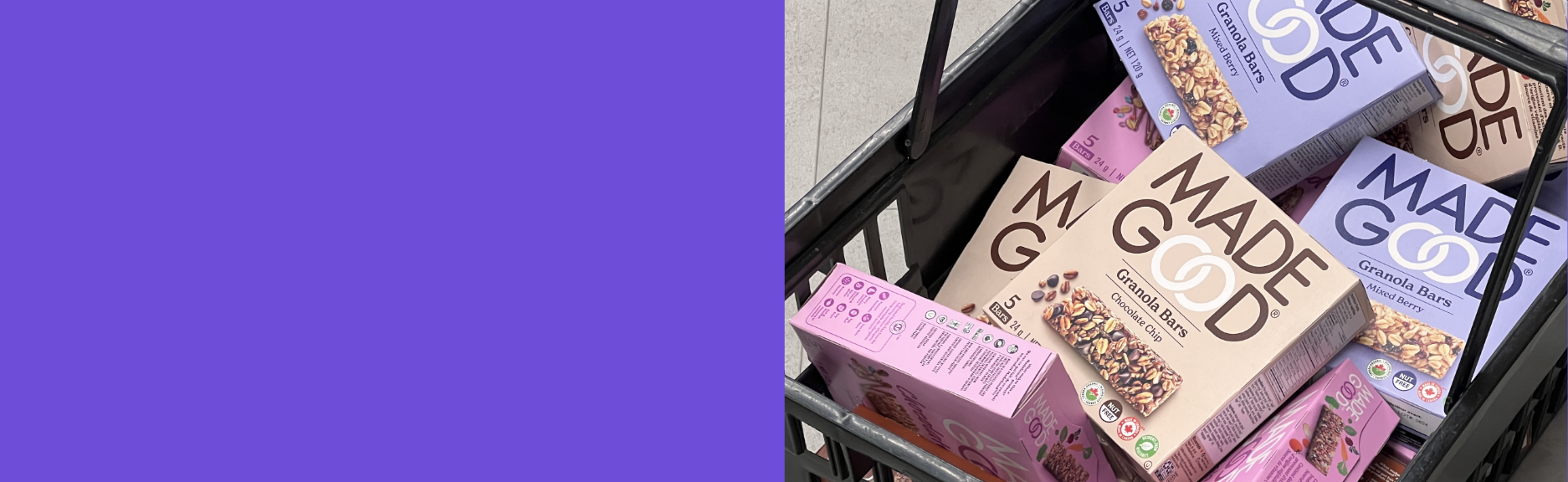 A shopping basket filled with various boxes of Made Good granola bars in oatmeal and mixed berry flavors, featuring earthy-toned packaging.